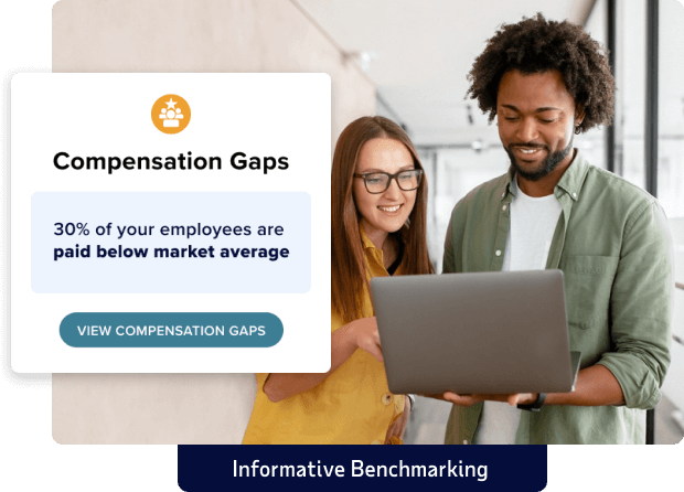 Inset of sample compensation gap message set over image of two employees looking at a laptop